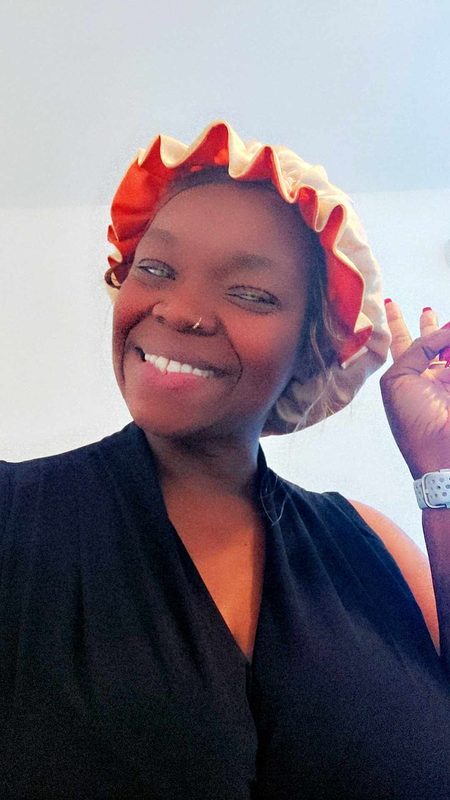 Nikki wearing her orange satin bonnet