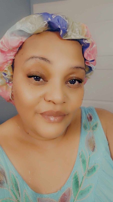 Tarshi wearing her pastel satin bonnet